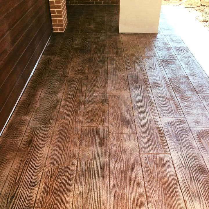 Brown timber-look stencilled concrete under a covered porch