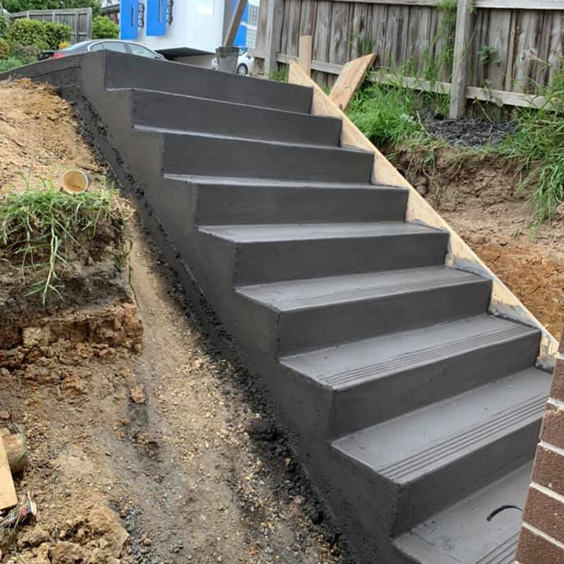 New concrete steps built into a dug-out slope